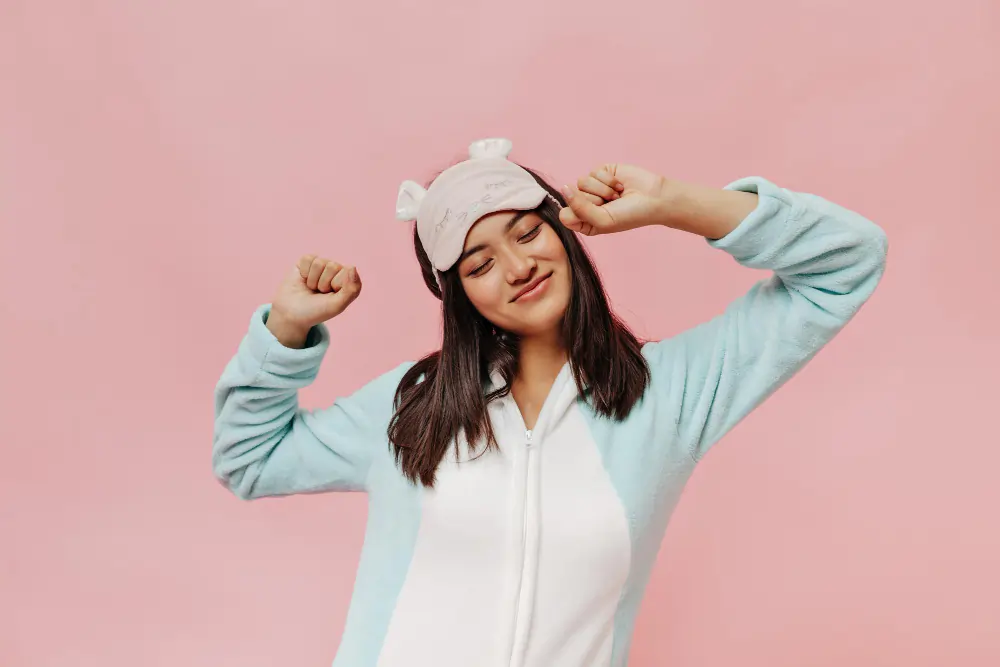 Sleep Wellness Guide 2026 - Girl shown in image waking up with happy mode after good sleep .