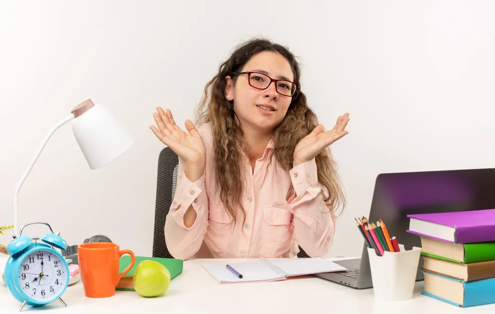Woman exploring ADHD strengths and positive traits while working at a desk, showing creativity, focus, and unique thinking abilities associated with ADHD benefits.