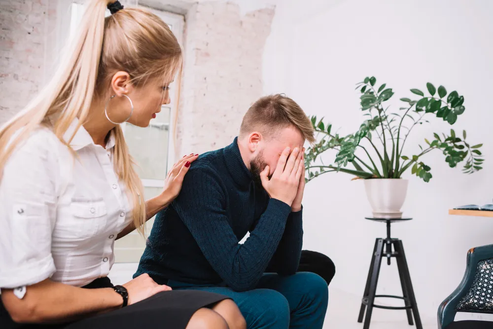Person feeling overwhelmed and emotionally distressed, representing ADHD emotional dysregulation and rejection sensitivity symptoms.