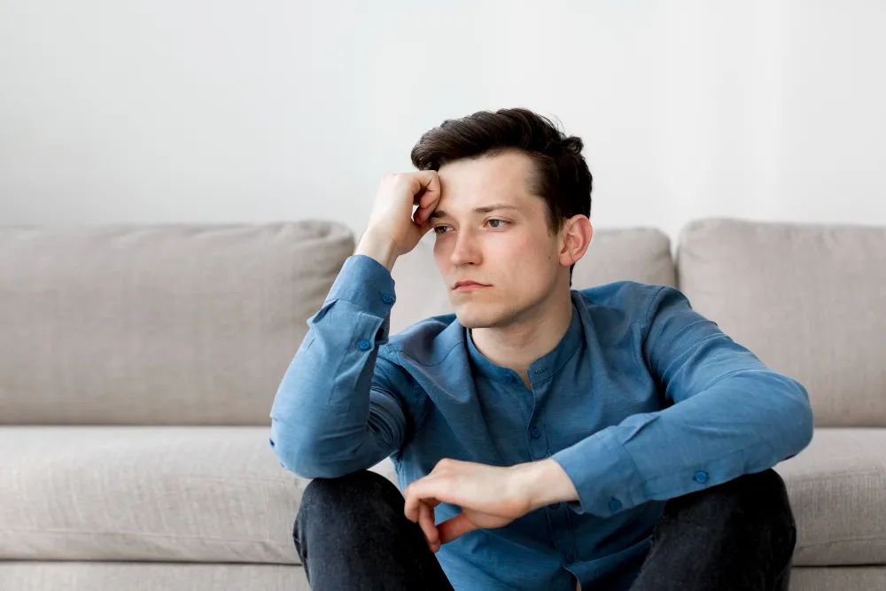 A thoughtful person reflecting on the feelings, focus challenges, and everyday experiences often associated with living with ADHD